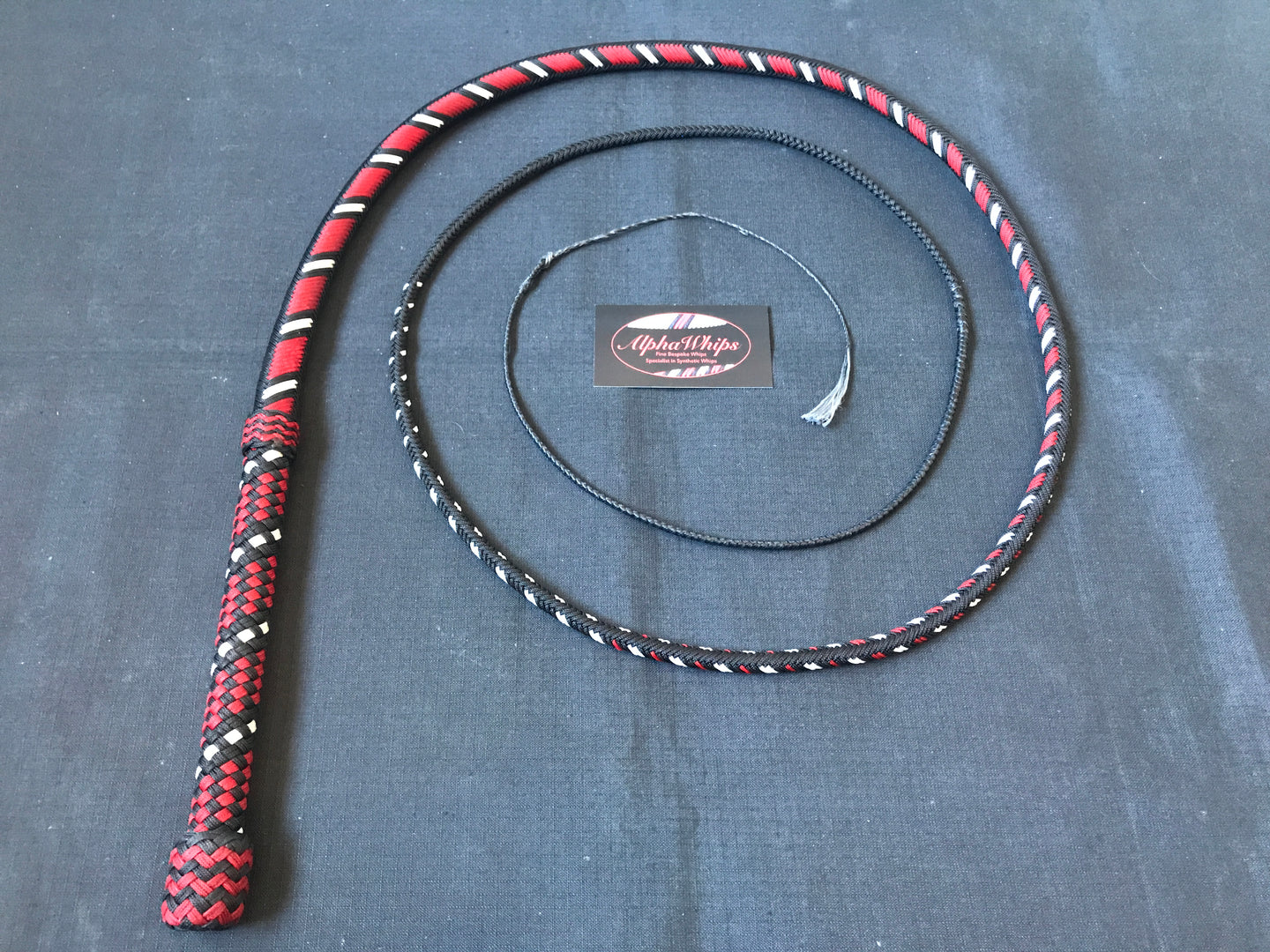 AlphaWhips 28 plait, Sport Series Nylon Paracord Bullwhip, 6 feet long. with Dyneema Fall, In black, red and white viper style pattern.